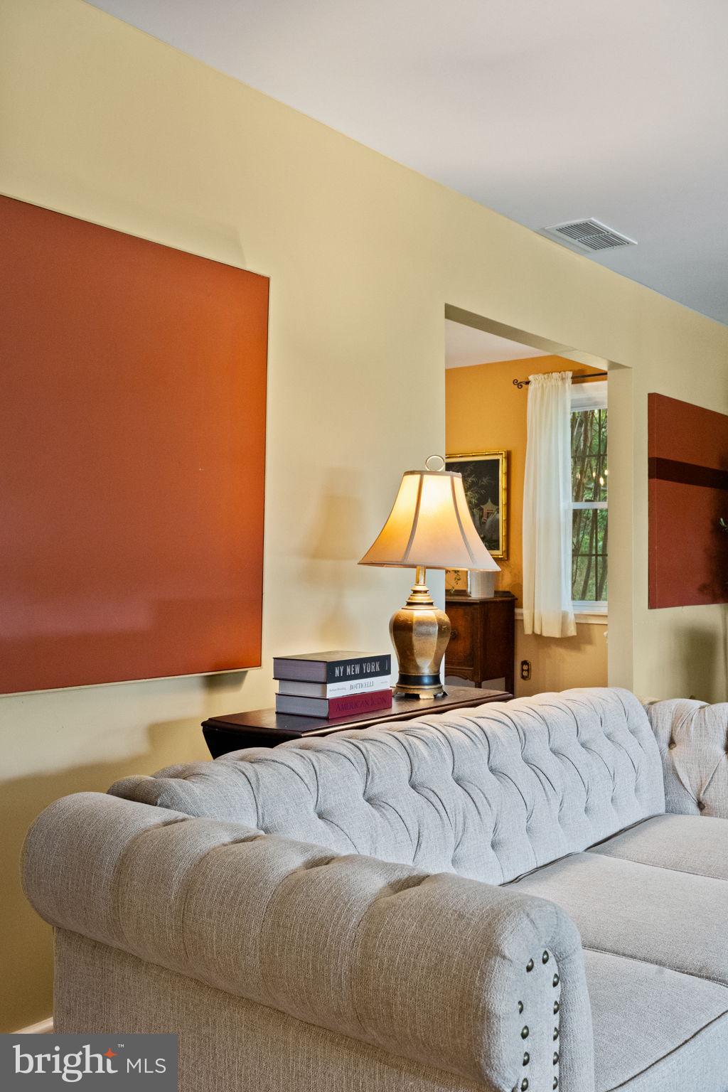 1014 Townsend Circle Wayne, PA 19087 - Photo 12 of 68 a living room with furniture a lamp and a large window