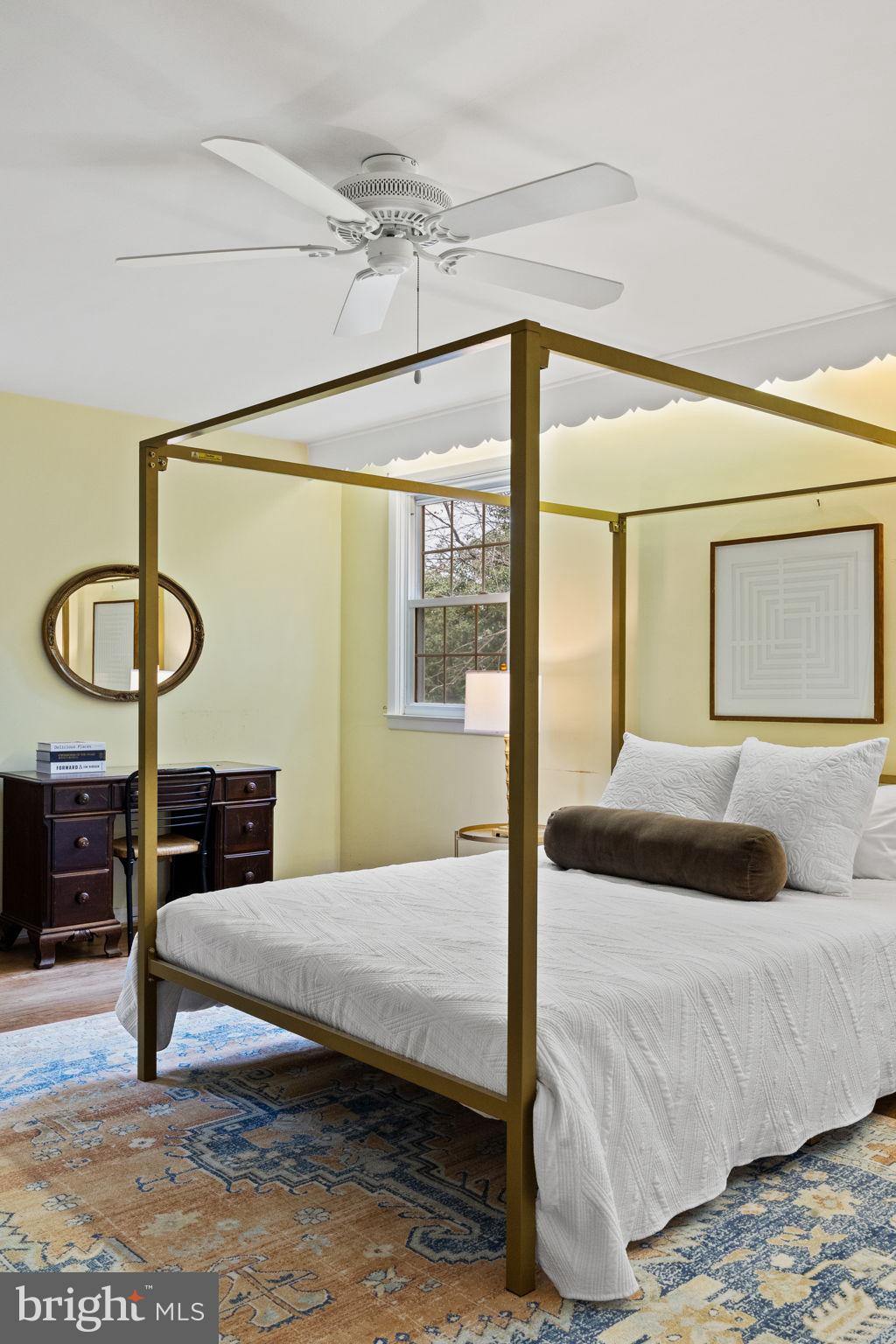 1014 Townsend Circle Wayne, PA 19087 - Photo 36 of 68 a bedroom with a bed a mirror and a large window