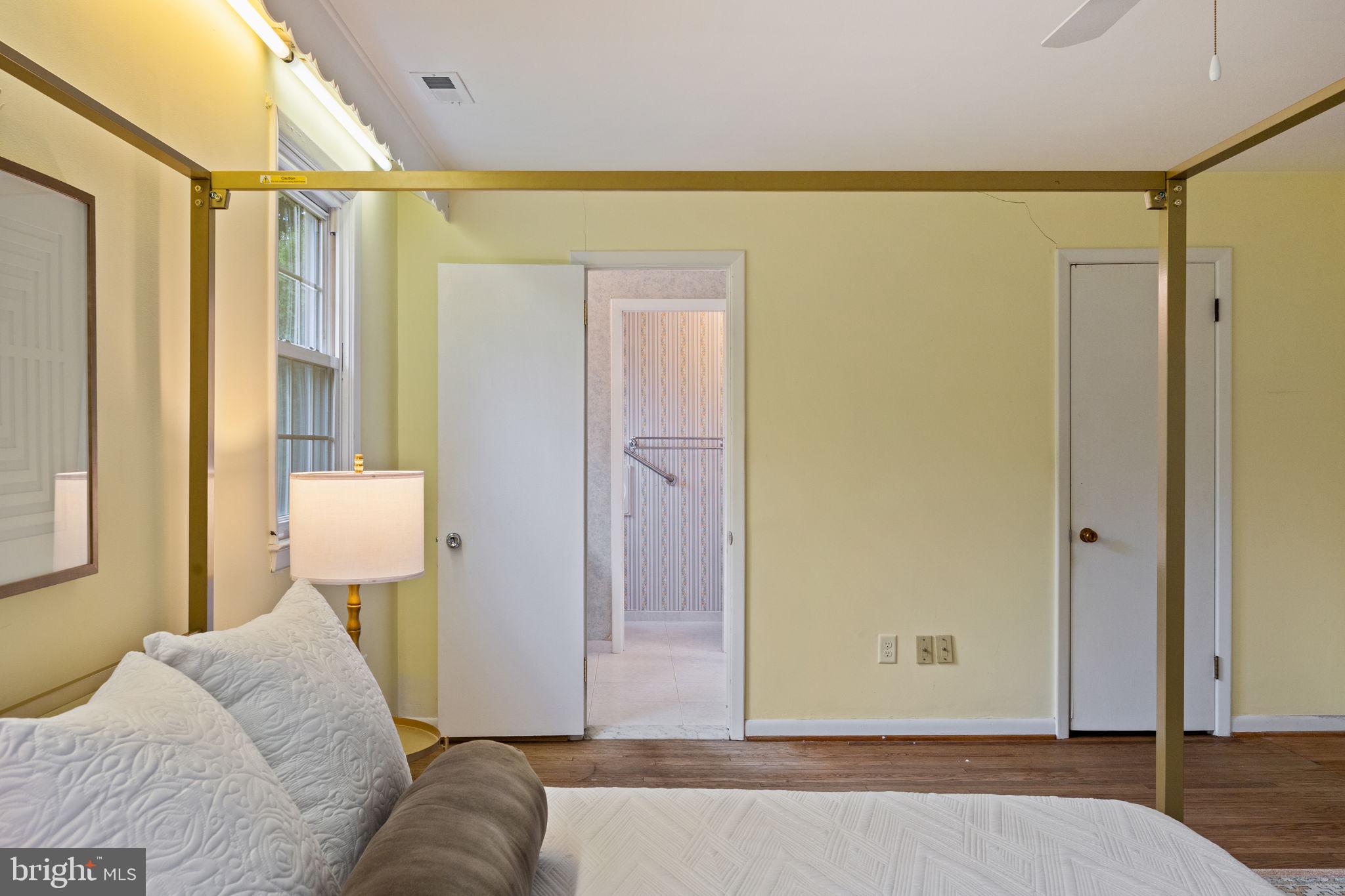 1014 Townsend Circle Wayne, PA 19087 - Photo 37 of 68 a bedroom with a bed and wooden floor