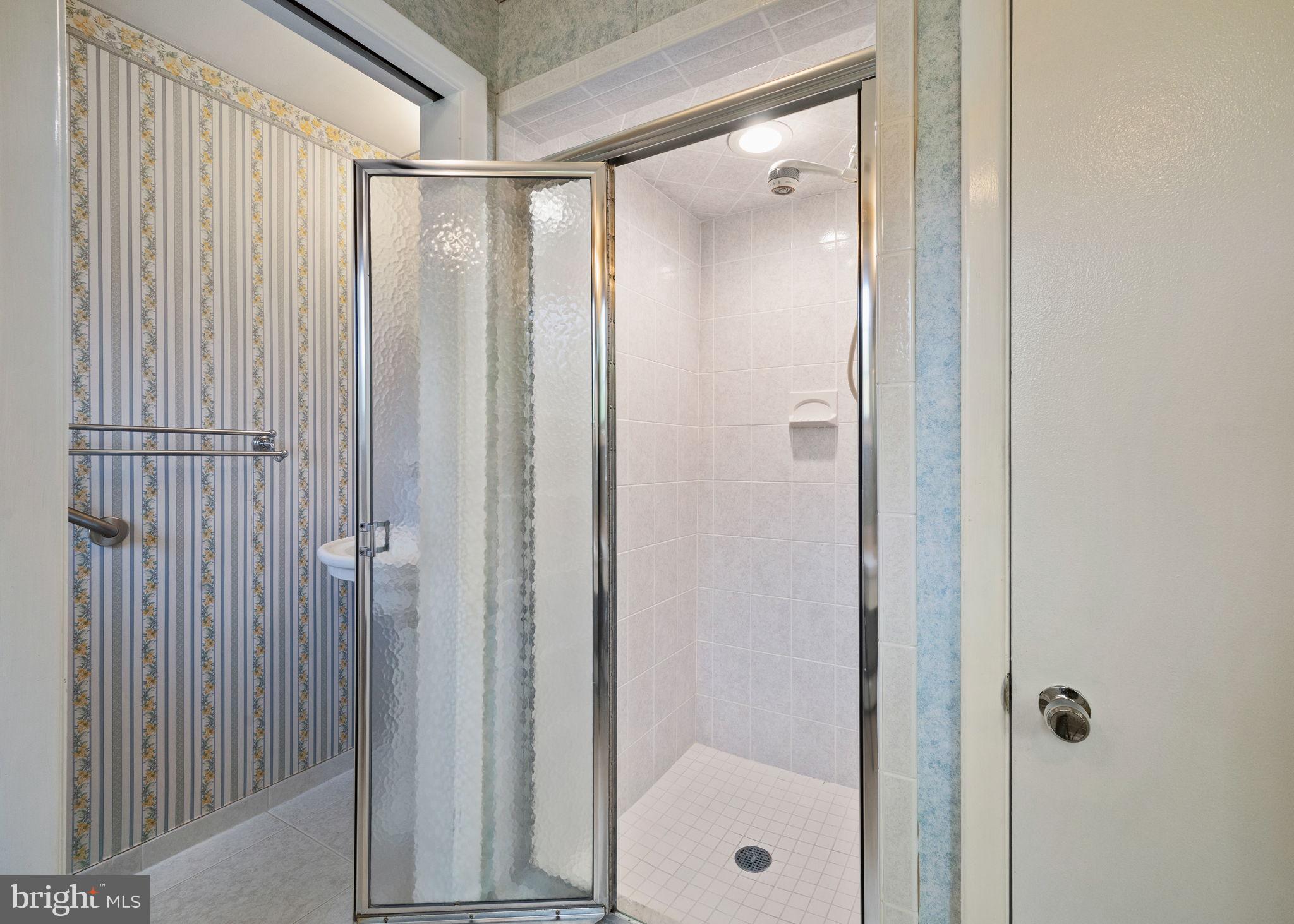 1014 Townsend Circle Wayne, PA 19087 - Photo 39 of 68 a bathroom with a glass shower door