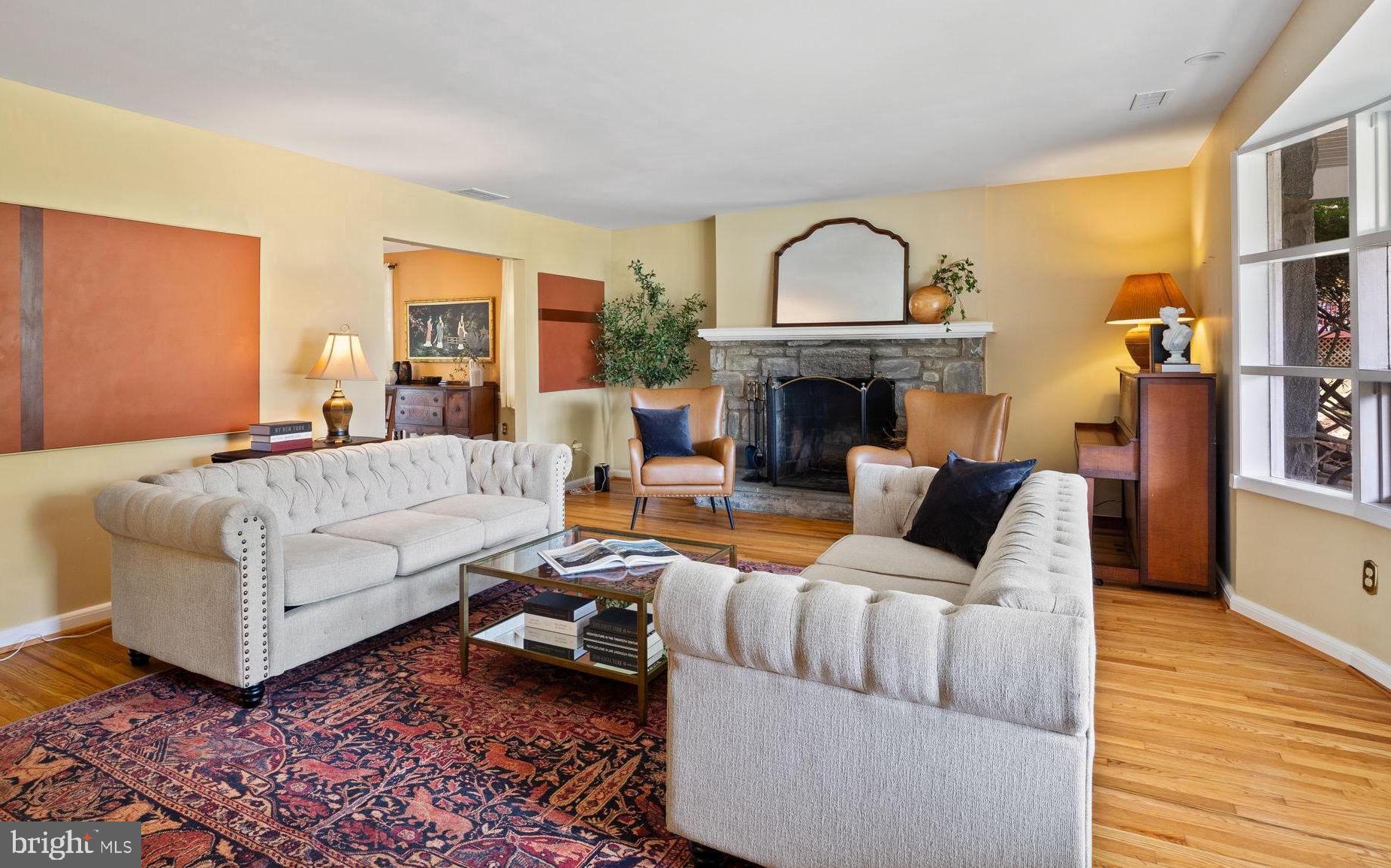 1014 Townsend Circle Wayne, PA 19087 - Photo 4 of 68 a living room with furniture a fireplace and a wooden floor