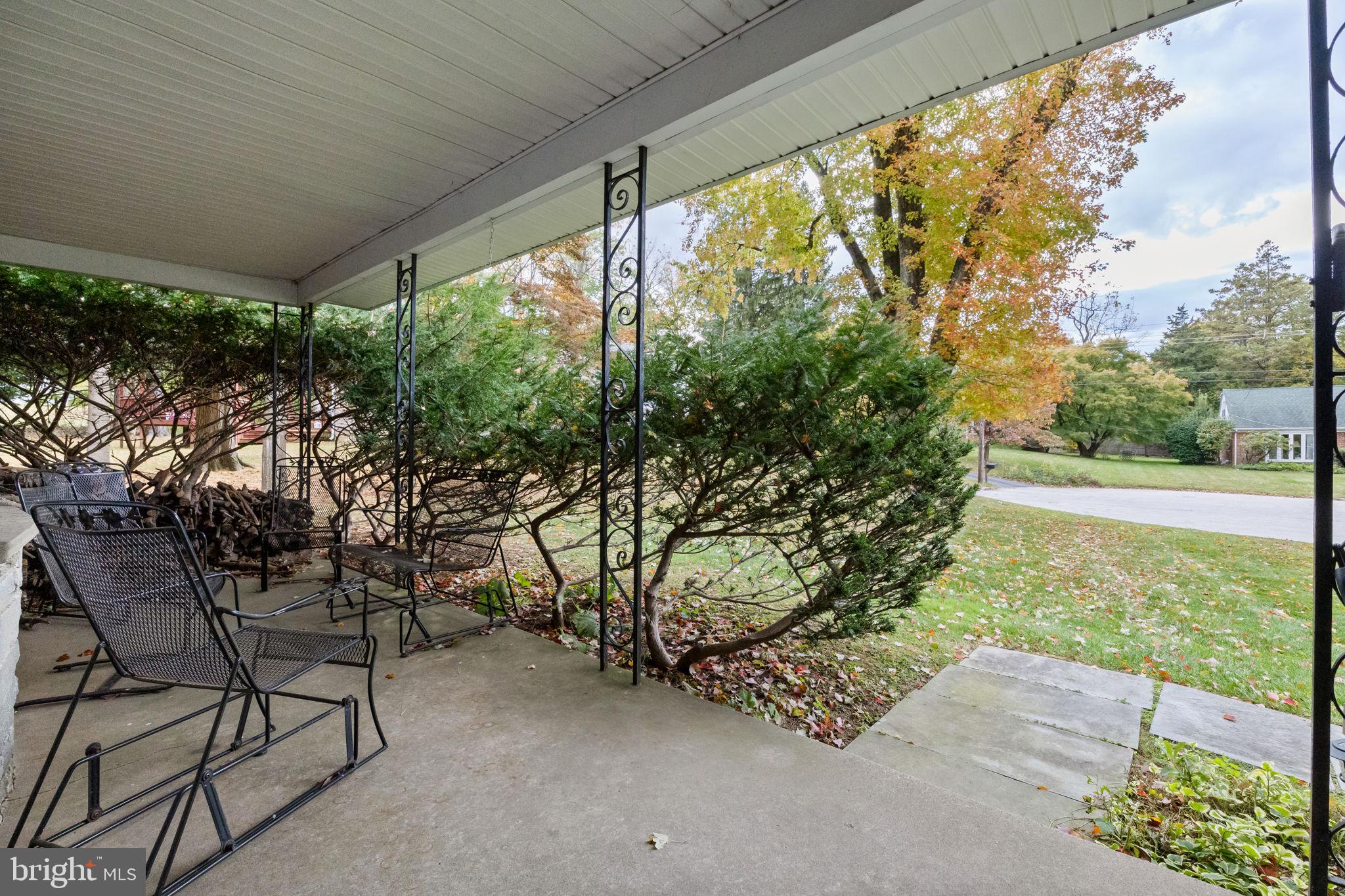 1014 Townsend Circle Wayne, PA 19087 - Photo 59 of 68 a view of a yard with table and chairs and wooden fence