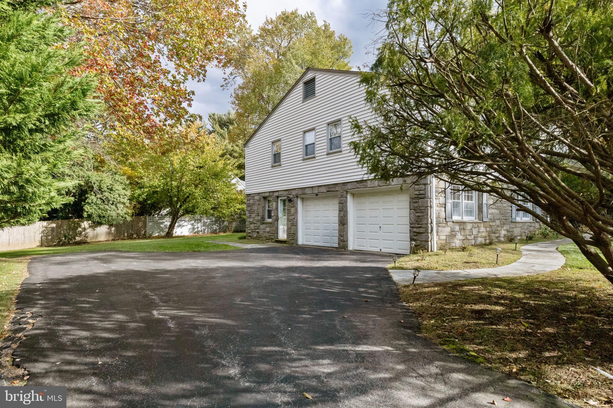 1014 Townsend Circle Wayne, PA 19087 - Photo 67 of 68 a front view of a house with a yard and garage