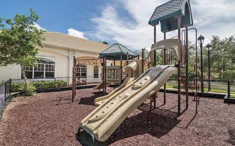 a front view of a building with garden