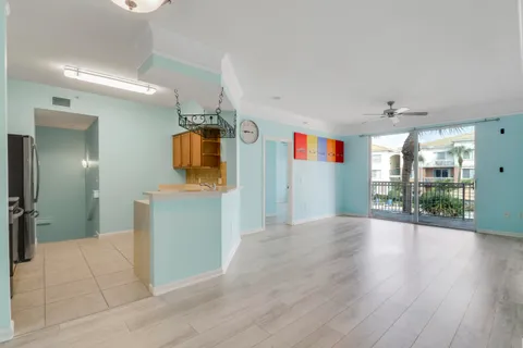 a view of a livingroom with a ceiling fan and window