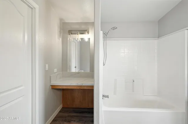 a bathroom with a bathtub and a sink