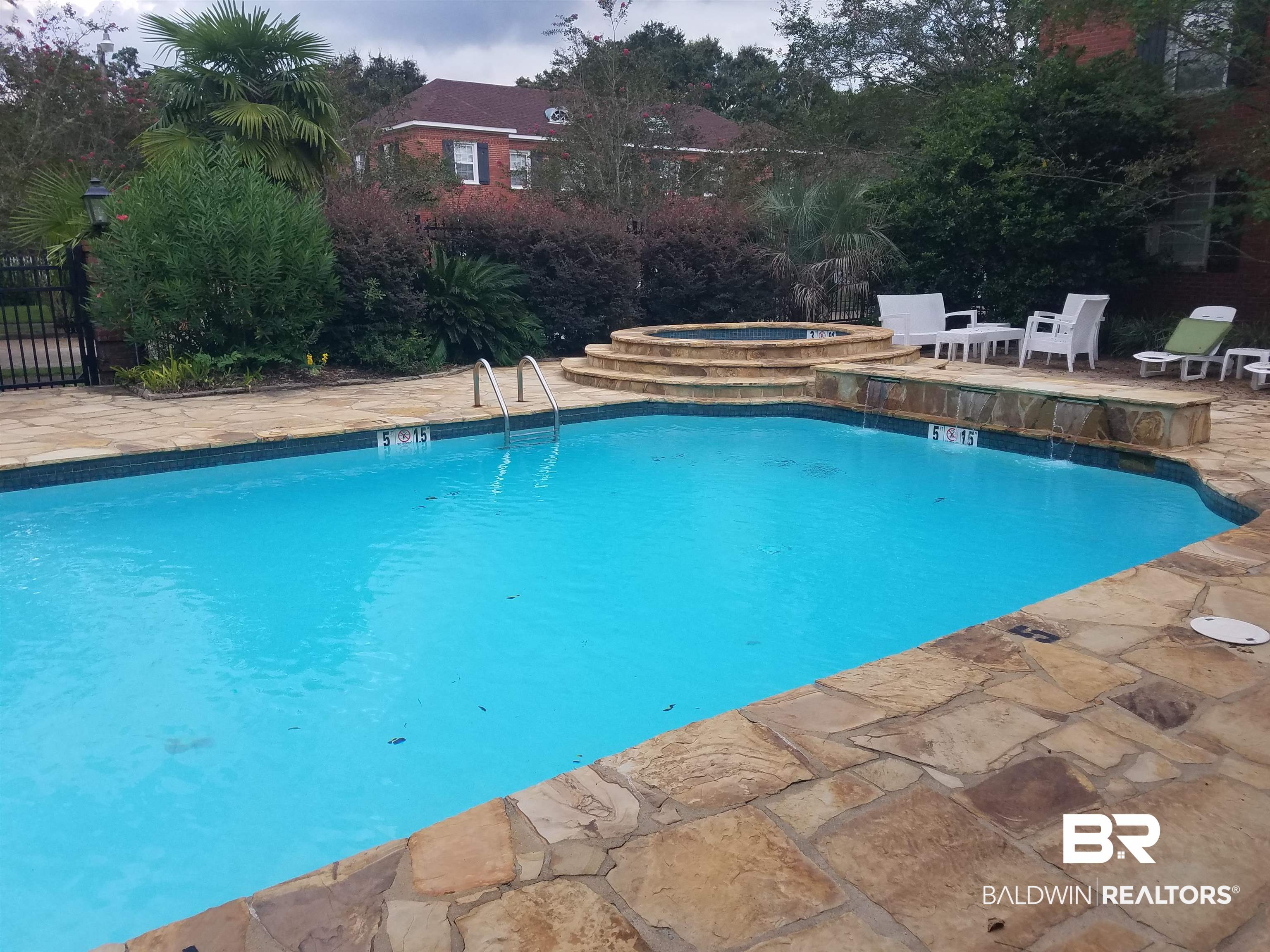 214 Upham Street, Unit 7C Mobile, AL 36607 - Photo 27 of 32 View of swimming pool featuring a patio area and a hot tub
