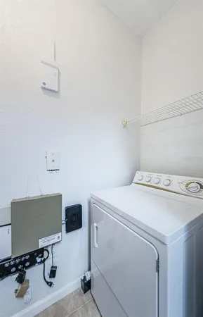 a bathroom with a granite countertop sink a toilet and a mirror