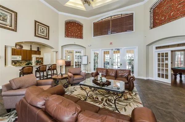 a large kitchen with stainless steel appliances granite countertop a stove and a sink