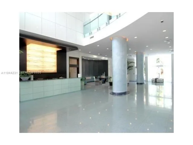 a living room with stainless steel appliances kitchen island granite countertop furniture and a view