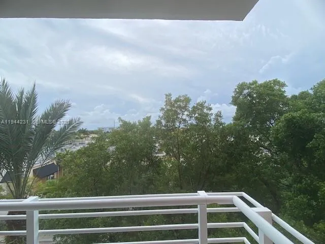 a view of a balcony with an outdoor space