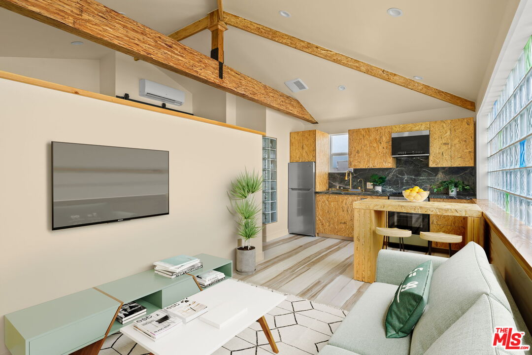 621 Rose Avenue, Unit 623 1/2 Venice, CA 90291 - Photo 4 of 10 a living room with stainless steel appliances furniture and a kitchen view