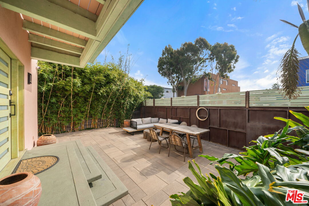 621 Rose Avenue, Unit 623 1/2 Venice, CA 90291 - Photo 10 of 10 a view of a patio with table and chairs and potted plants