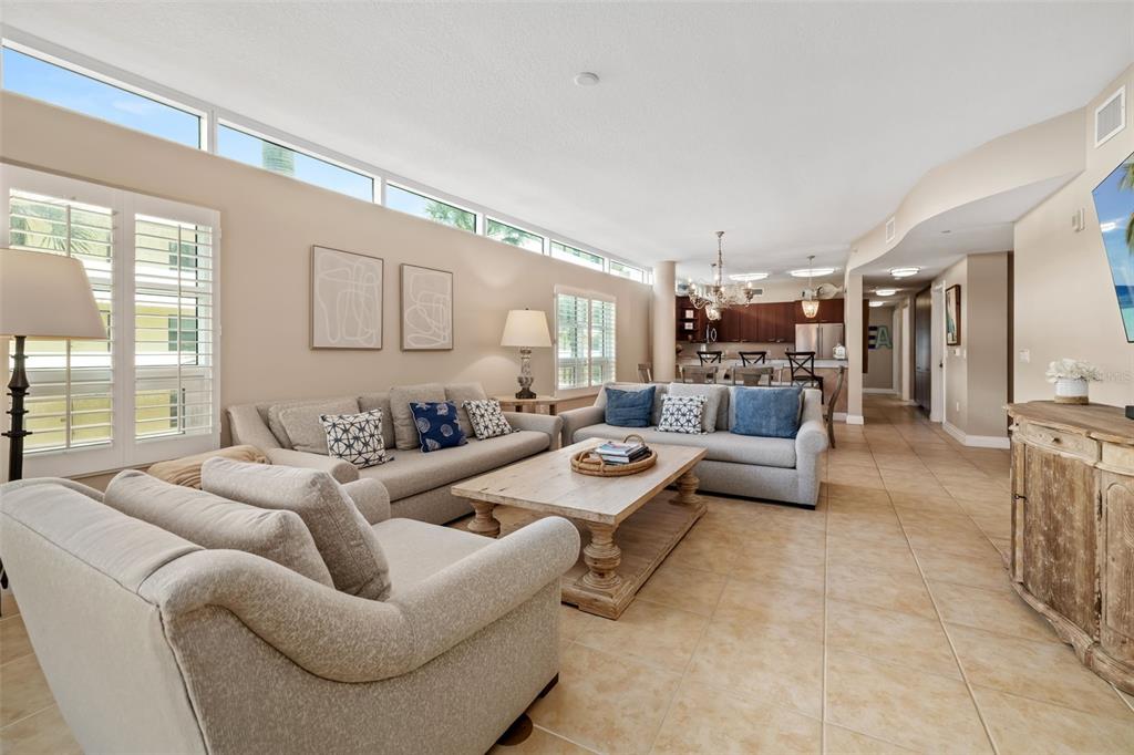 6512 Midnight Pass Road, Unit 204 Sarasota, FL 34242 - Photo 13 of 64 a living room with furniture and a large window