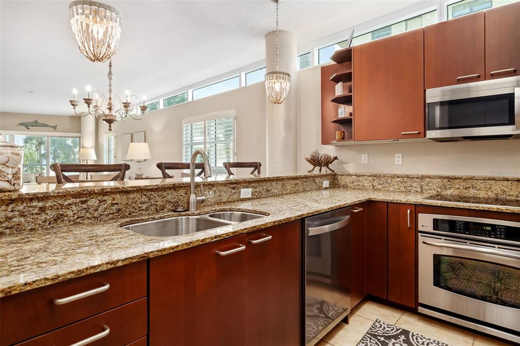 6512 Midnight Pass Road, Unit 204 Sarasota, FL 34242 - Photo 17 of 64 a kitchen with a sink and a microwave