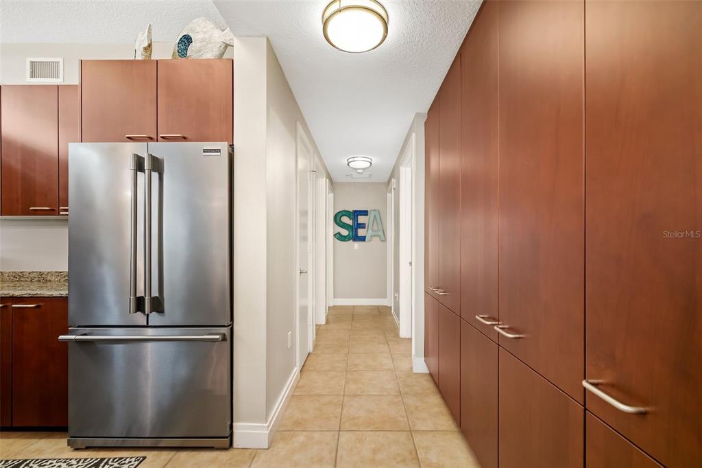 6512 Midnight Pass Road, Unit 204 Sarasota, FL 34242 - Photo 19 of 64 a view of a kitchen with a refrigerator