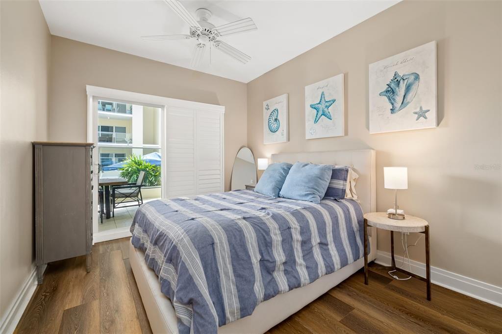 6512 Midnight Pass Road, Unit 204 Sarasota, FL 34242 - Photo 25 of 64 a bedroom with a bed and a window