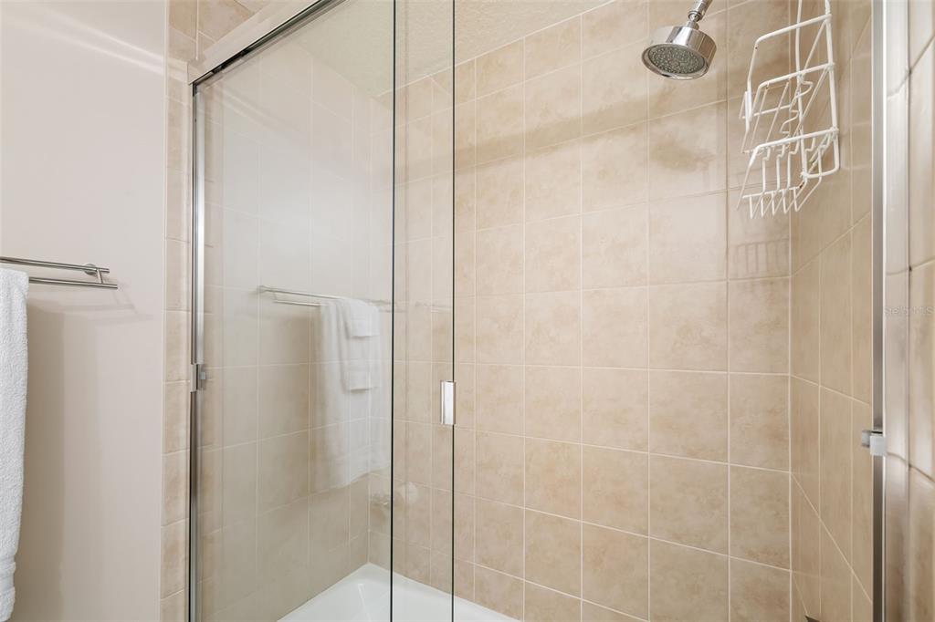 6512 Midnight Pass Road, Unit 204 Sarasota, FL 34242 - Photo 30 of 64 a bathroom with a shower