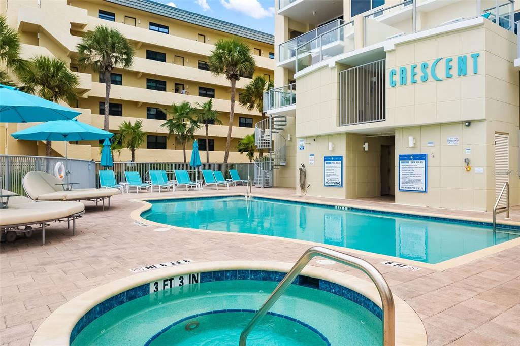 6512 Midnight Pass Road, Unit 204 Sarasota, FL 34242 - Photo 39 of 64 a swimming pool with outdoor seating and yard