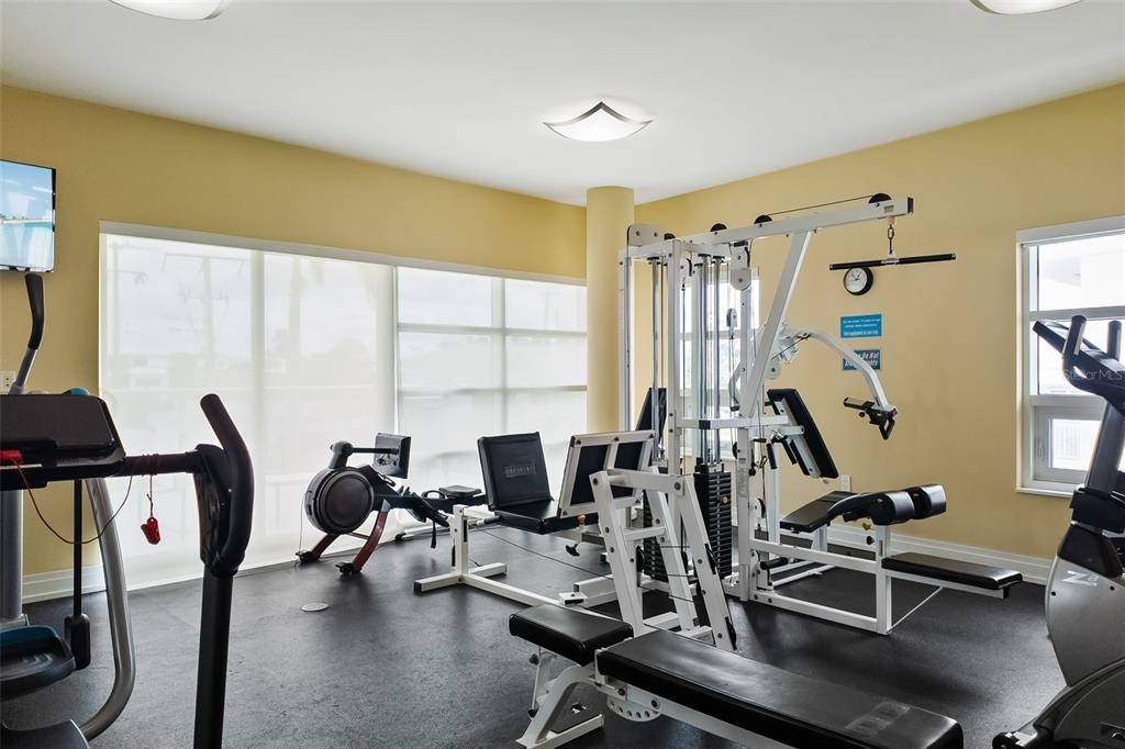 6512 Midnight Pass Road, Unit 204 Sarasota, FL 34242 - Photo 45 of 64 a view of a livingroom with workspace and windows