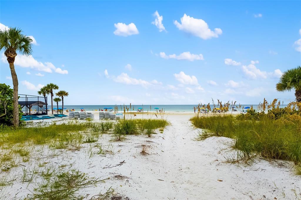 6512 Midnight Pass Road, Unit 204 Sarasota, FL 34242 - Photo 48 of 64 a view of a lake with a beach