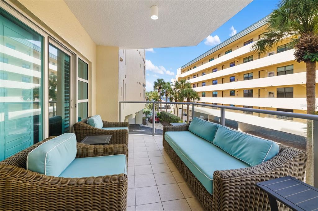 6512 Midnight Pass Road, Unit 204 Sarasota, FL 34242 - Photo 8 of 64 a living room with furniture and a large window