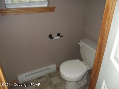 2302 Hill Road Effort, PA 18330 - Photo 4 of 9 a white toilet sitting next to a shower
