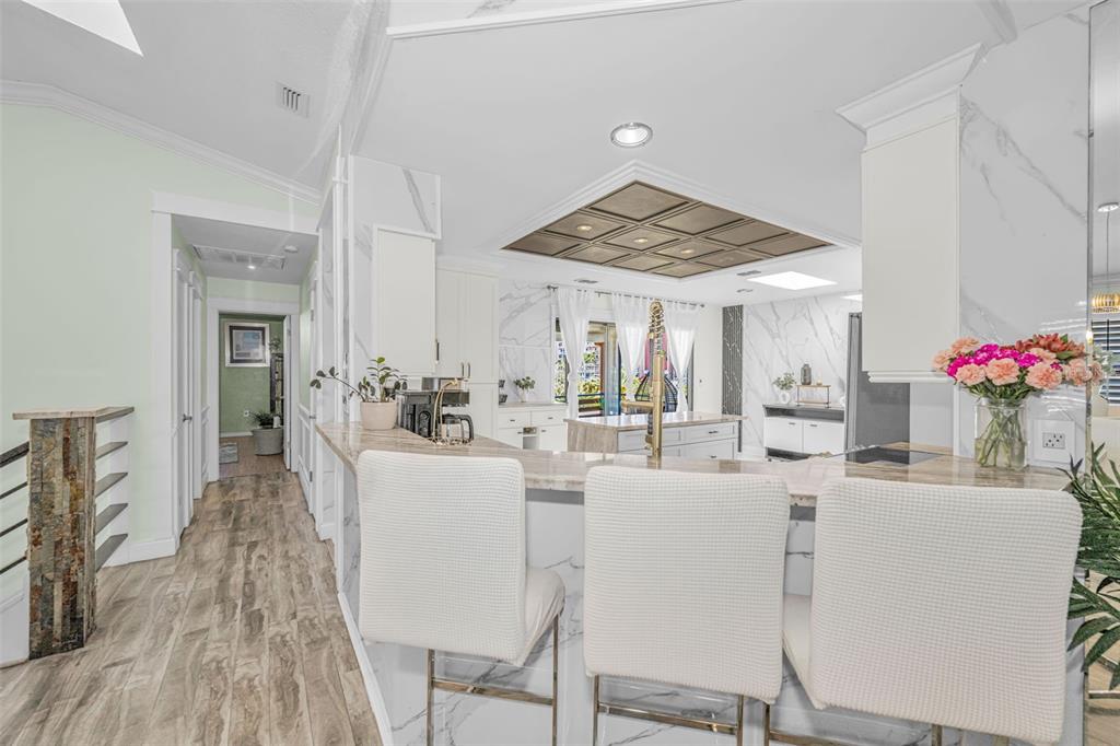 6009 Bayway Court New Port Richey, FL 34652 - Photo 33 of 93 a view of a dining room with furniture and wooden floor