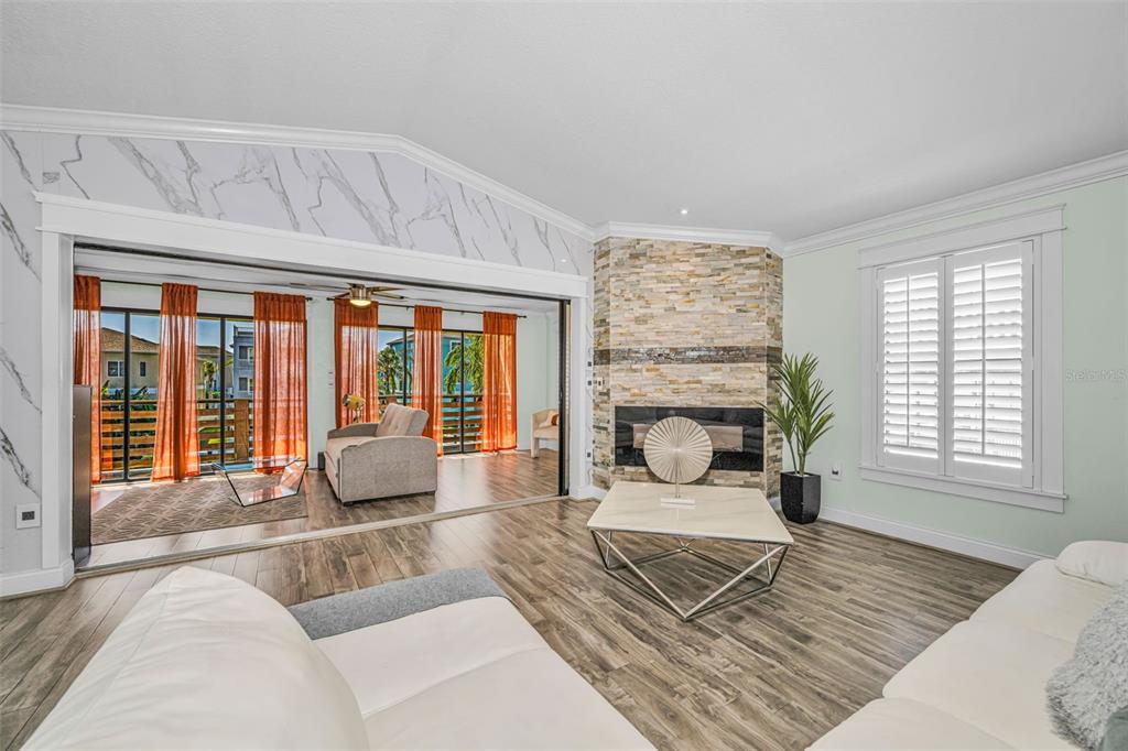6009 Bayway Court New Port Richey, FL 34652 - Photo 34 of 93 a living room with furniture and a fireplace