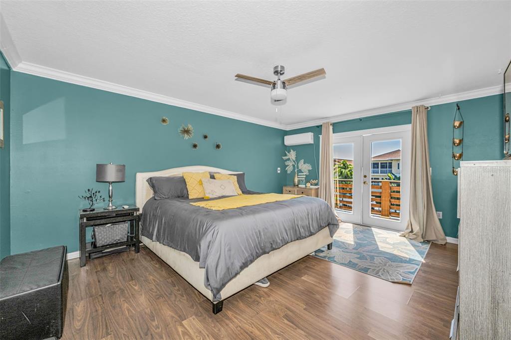 6009 Bayway Court New Port Richey, FL 34652 - Photo 41 of 93 a spacious bedroom with a bed and a window