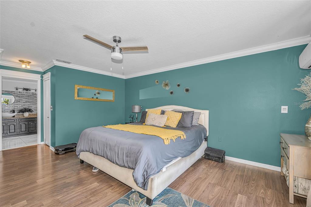 6009 Bayway Court New Port Richey, FL 34652 - Photo 45 of 93 a bedroom with a bed and wooden floor