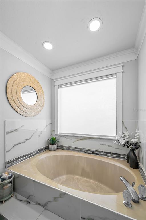 6009 Bayway Court New Port Richey, FL 34652 - Photo 47 of 93 a bathroom with a tub and a sink