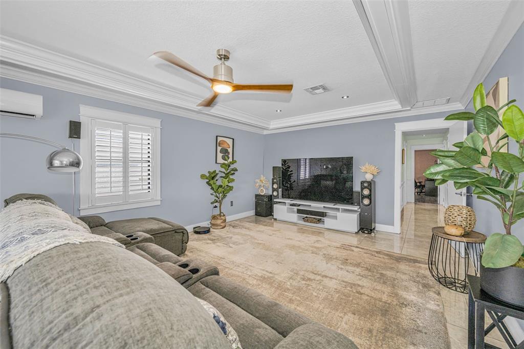 6009 Bayway Court New Port Richey, FL 34652 - Photo 51 of 93 a living room with furniture and a flat screen tv