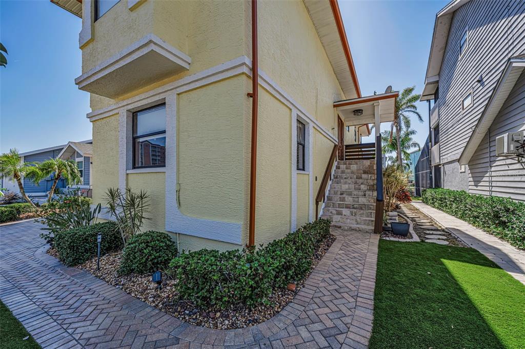 6009 Bayway Court New Port Richey, FL 34652 - Photo 6 of 93 a view of a house with brick walls and stairs walls