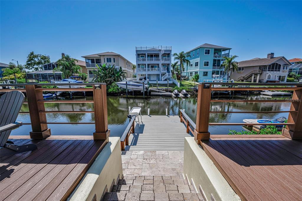 6009 Bayway Court New Port Richey, FL 34652 - Photo 69 of 93 a view of a balcony with wooden floor and outdoor seating