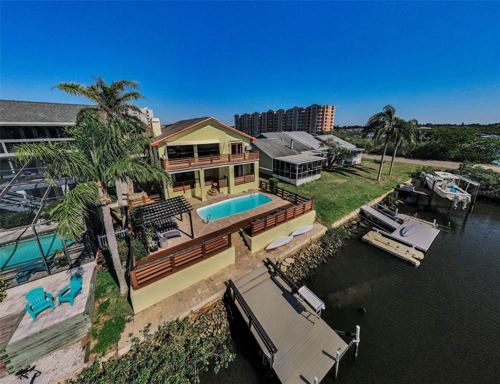 6009 Bayway Court New Port Richey, FL 34652 - Photo 75 of 93 a view of a house with pool and chairs