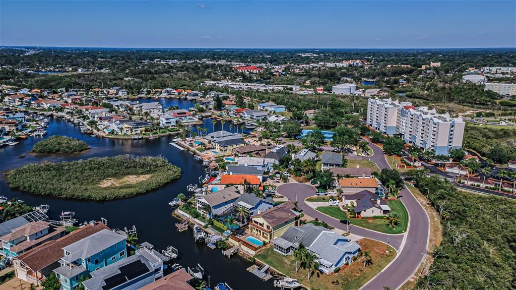 6009 Bayway Court New Port Richey, FL 34652 - Photo 77 of 93 an aerial view of a house with a swimming pool yard and outdoor seating