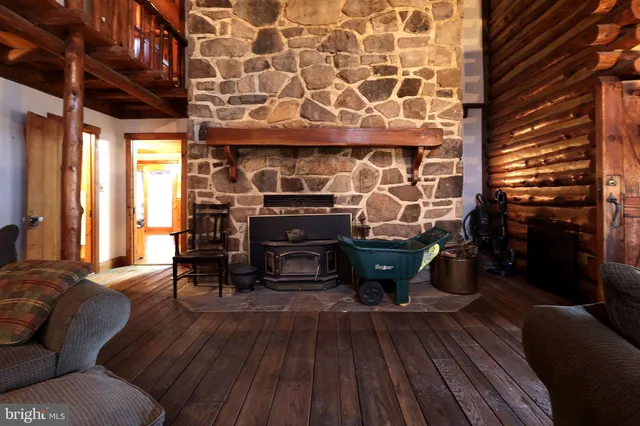 a kitchen with stainless steel appliances granite countertop wooden cabinets a sink and a large window