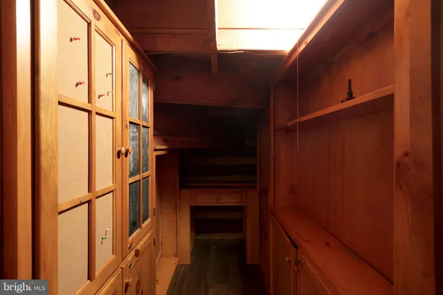 a view of a room with furniture and window