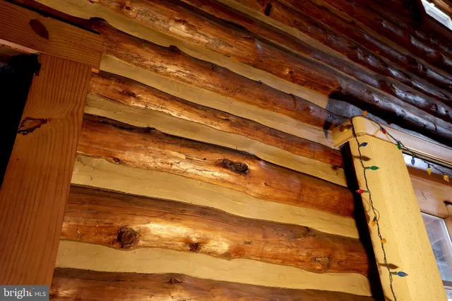 a kitchen with stainless steel appliances granite countertop a refrigerator a sink dishwasher a stove and a dining table with wooden floor