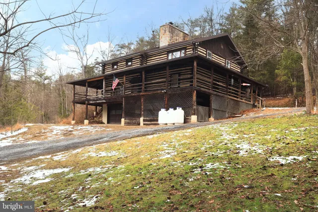 a view of a house with a snow on the road