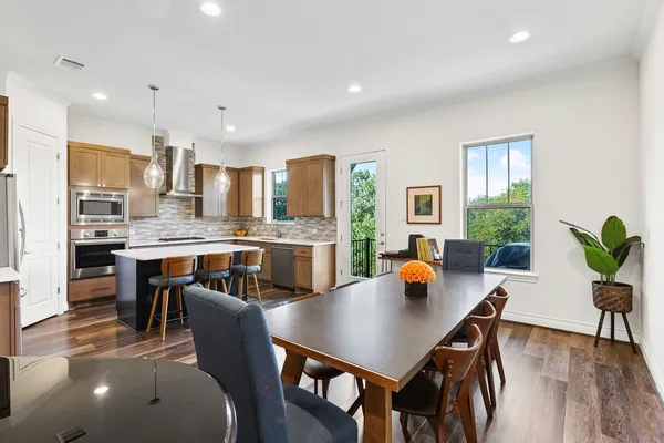 a kitchen with a table and chairs in it