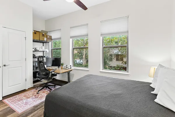 a bed room with a bed and a window