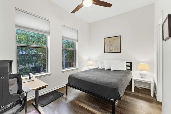 a bedroom with a bed and a table