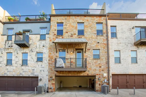 a view of building with glass windows