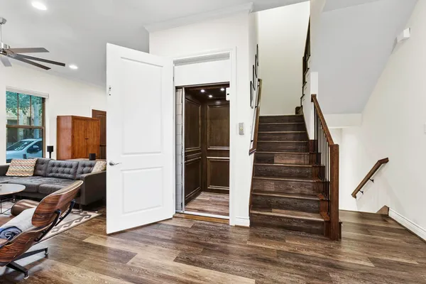 a view of entryway with livingroom and wooden floor