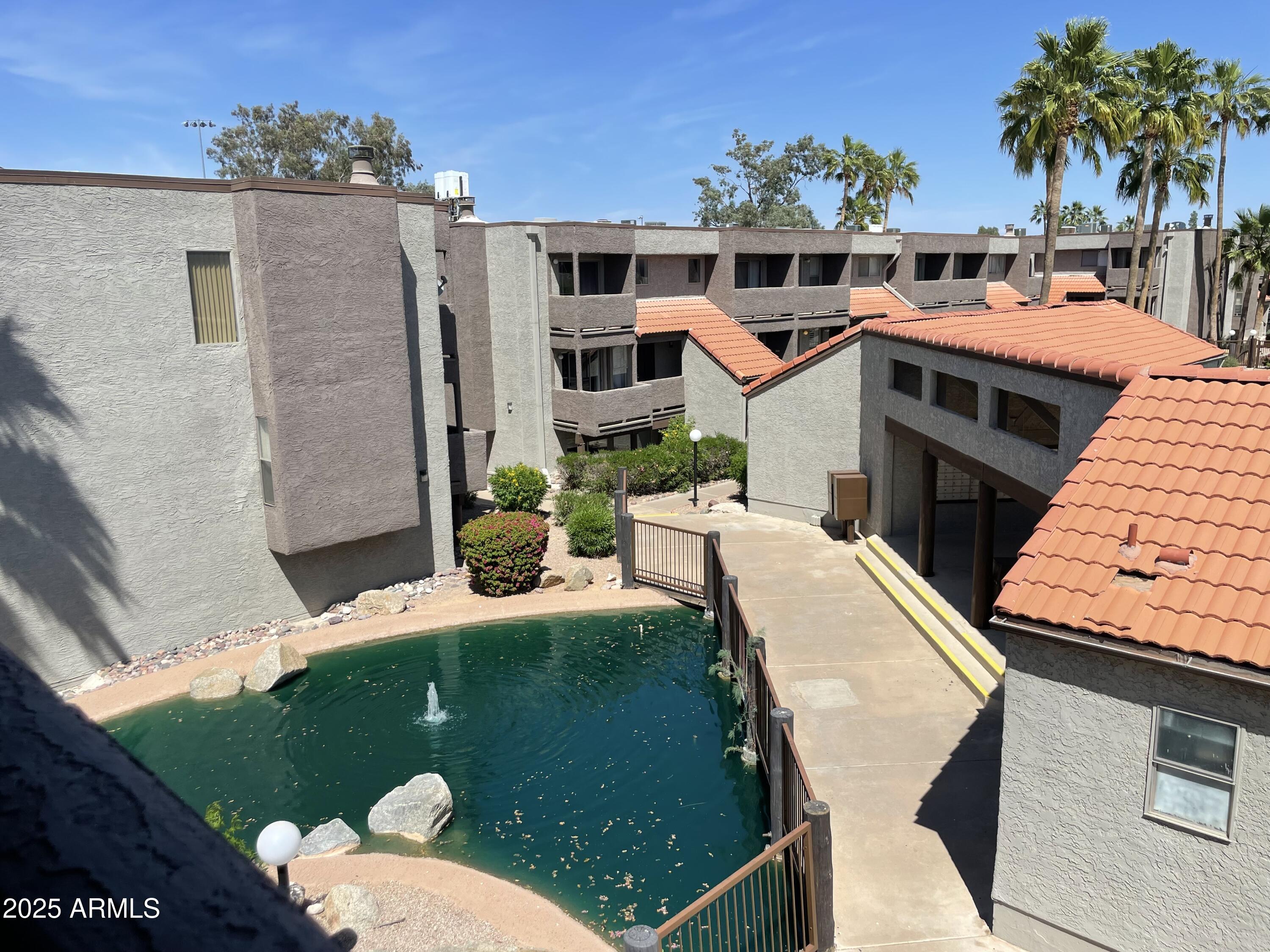 1645 West Baseline Road, Unit 2171 Mesa, AZ 85202 - Photo 8 of 11 a view of a house with backyard