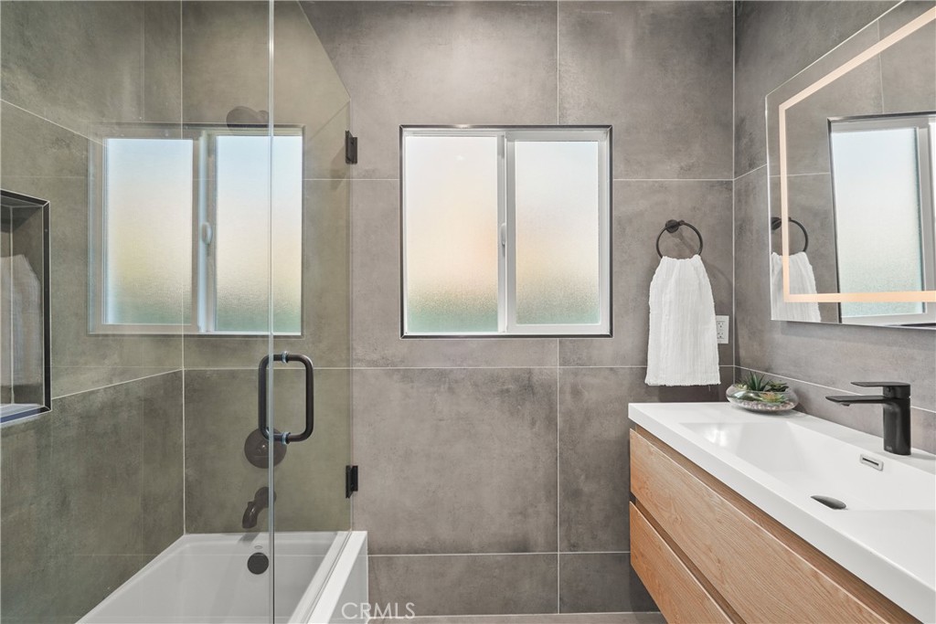 775 Morada Place Altadena, CA 91001 - Photo 17 of 24 a bathroom with a double vanity sink mirror and shower