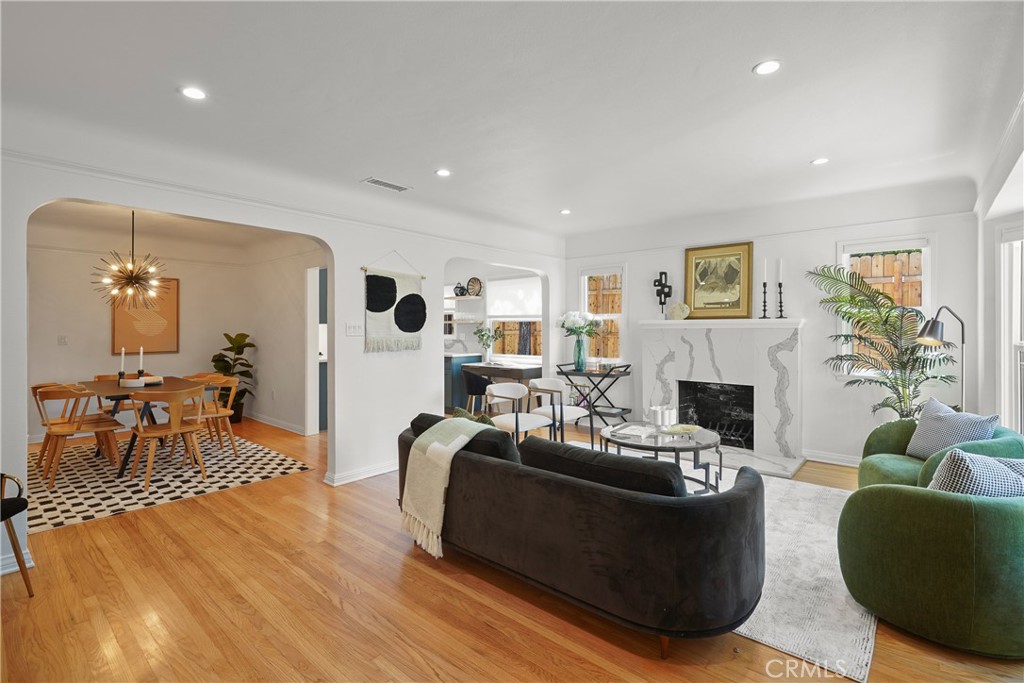 775 Morada Place Altadena, CA 91001 - Photo 5 of 24 a living room with furniture a fireplace and a table