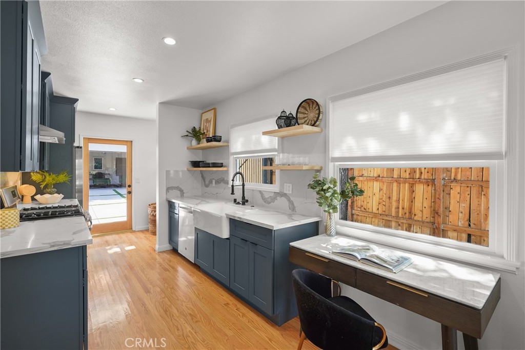 775 Morada Place Altadena, CA 91001 - Photo 7 of 24 a kitchen with a sink stove and cabinets